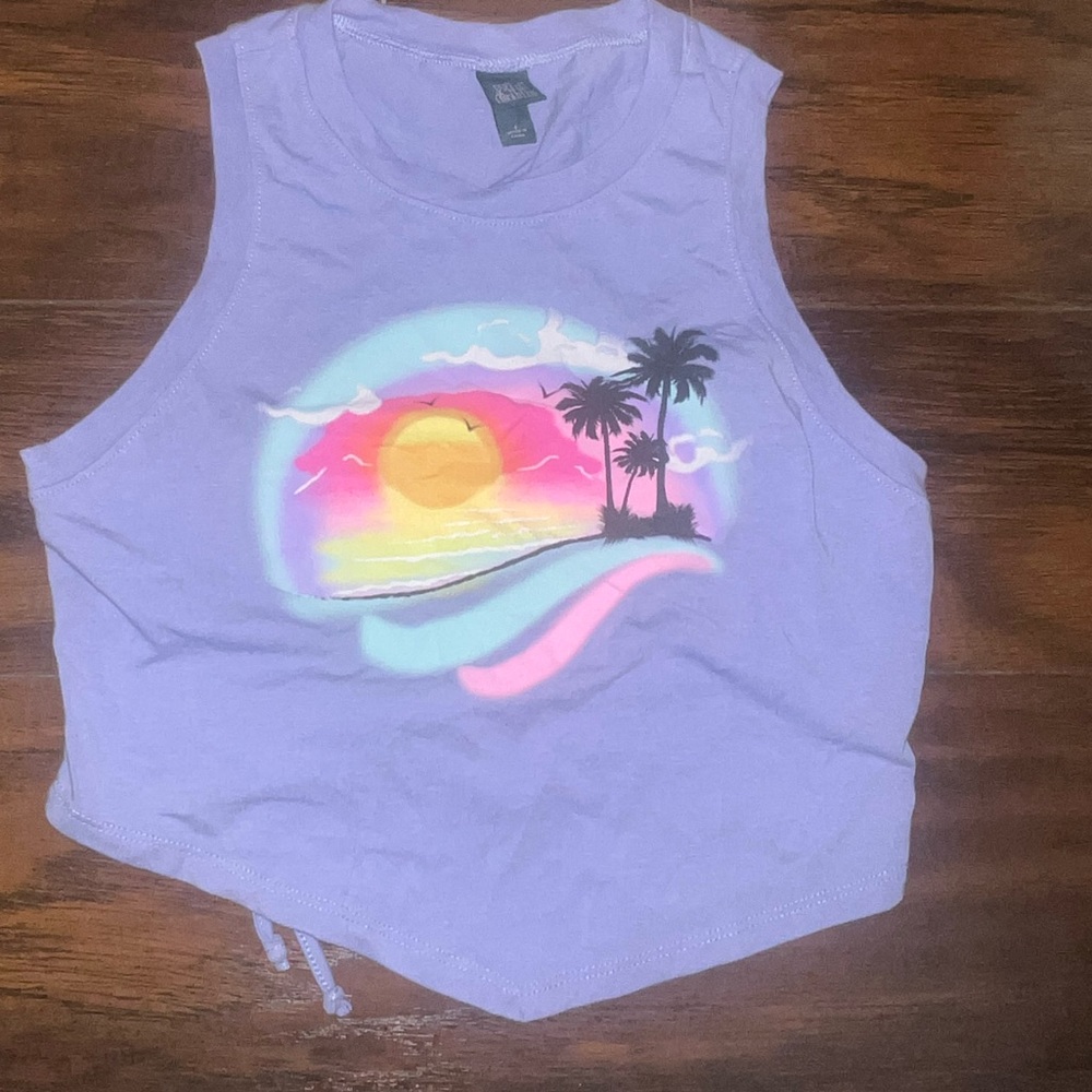 Cute cropped top with cut out in back!!Never worn/brand new without the tags!!